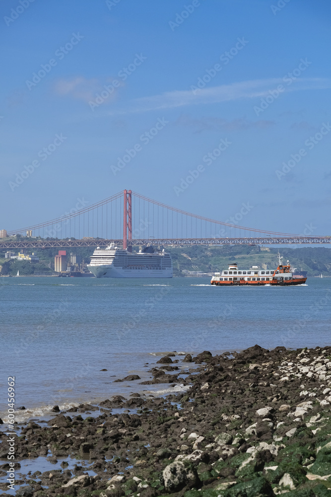 Large modern liner cruiseship cruise ship Poesia, Orchestra, Magnifica or Musica in port of Lisbon, Portugal during Mediterranean cruising with city skyline, Christos statue and suspension bridge Large modern liner cruiseship cruise ship Poesia, Orchestra, Magnifica or Musica in port of Lisbon, Portugal during Mediterranean cruising with city skyline, Christos statue and suspension bridge
