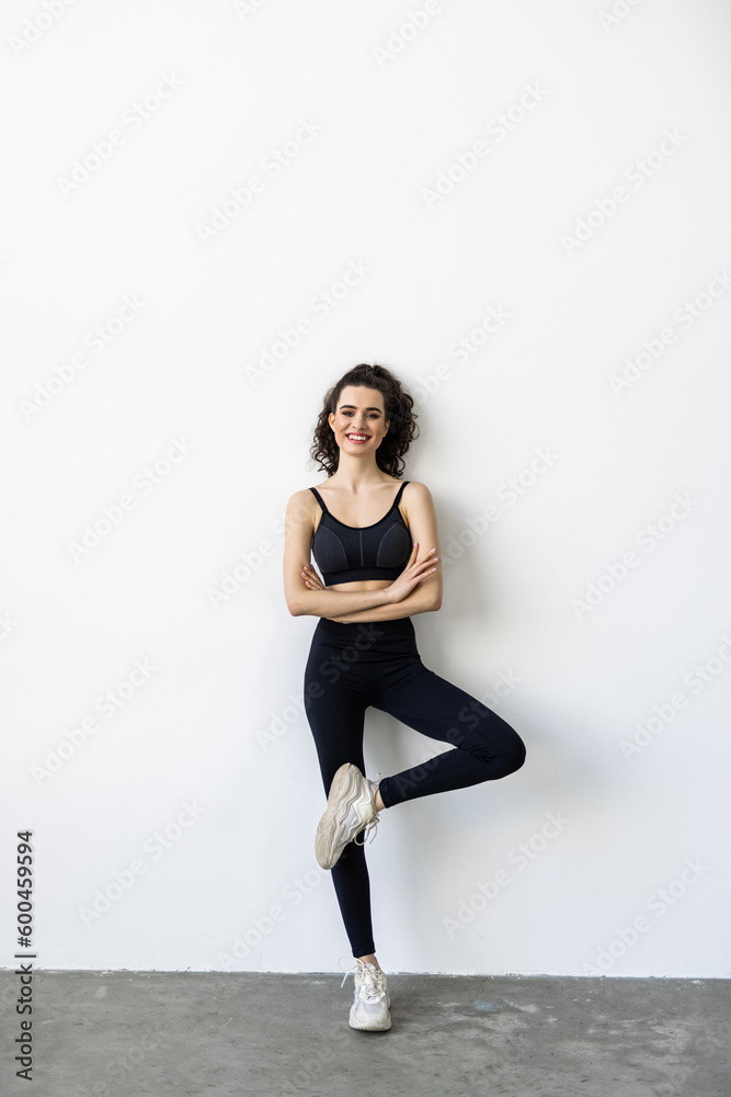Fototapeta premium Smiling woman with beautiful body after diet, isolated on white
