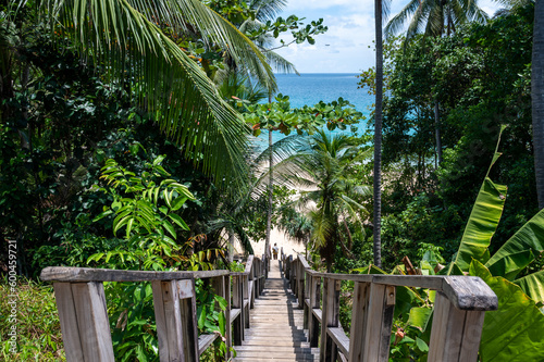 Fototapeta Naklejka Na Ścianę i Meble -  The wooden bridge goes down to the Naithon beach at Phuket, Thailand