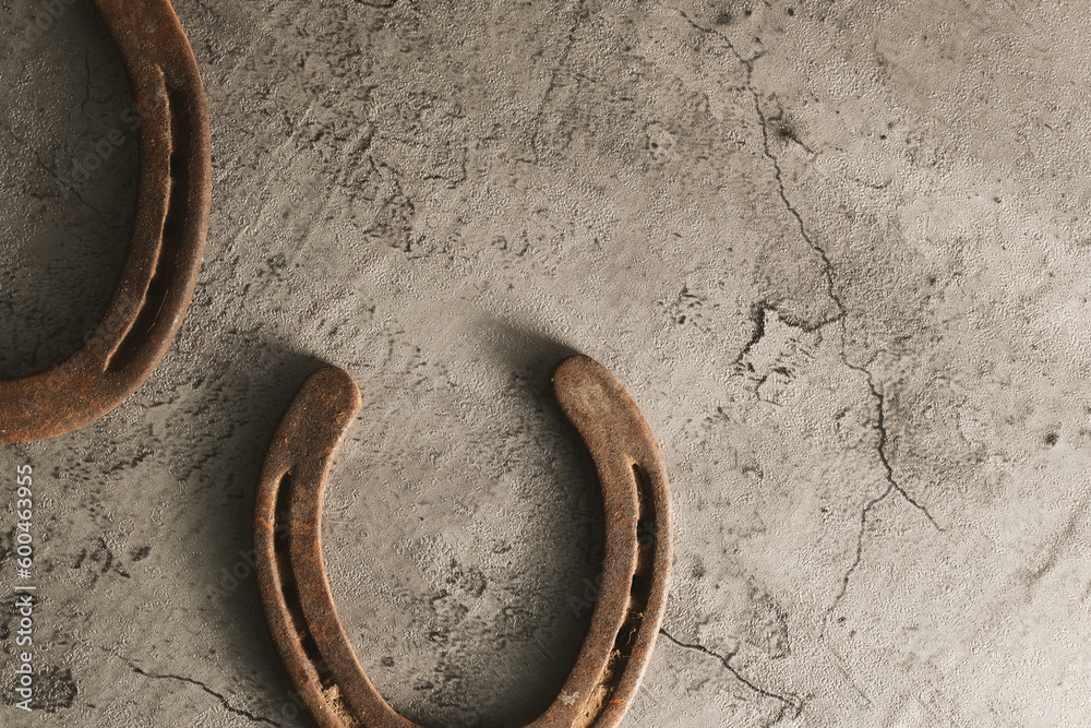 Old rustic western background with rough texture of used horseshoes and copy space. Old rustic western background with rough texture of used horseshoes and copy space.