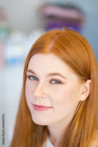 Portrait of beautiful redhead female smiling. Closeup woman face