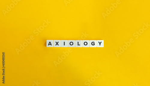 Axiology - philosophical study of value. Word on Letter Tiles on Yellow Background. Minimal Aesthetics.