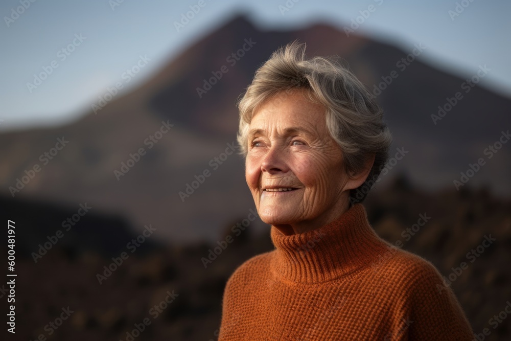 Medium shot portrait photography of a pleased woman in her 60s wearing a cozy sweater against a volcano or lava background. Generative AI