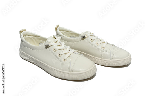 White unisex sneakers with white laces. Modern comfortable shoes.