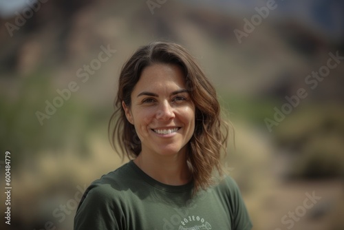 Close up of a beautiful caucasian woman smiling and looking at the camera.