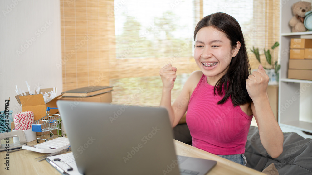 Woman was happy after receiving an order from an internet customer, New business style for young people working at home and owning businesses, Online shopping SME entrepreneur, Packing box. Woman was happy after receiving an order from an internet customer, New business style for young people working at home and owning businesses, Online shopping SME entrepreneur, Packing box.
