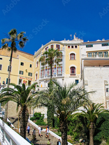 Cityscape with tourists walking on stairway at City of Mahón at Menorca island on a sunny spring day. Photo taken May 20th, 2005, Menorca, Spain. © Michael Derrer Fuchs