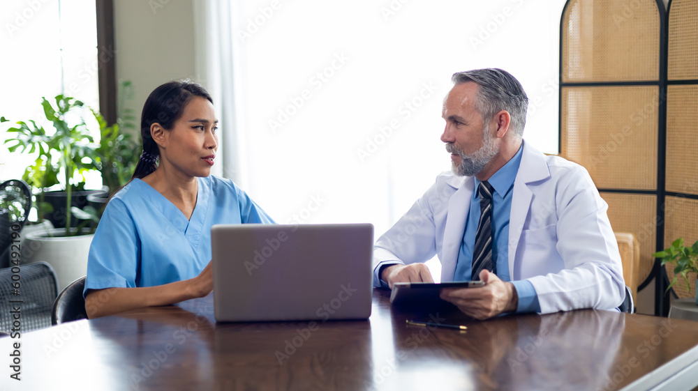 Professional male doctor with team and nurse in meeting. healthcare and medicine