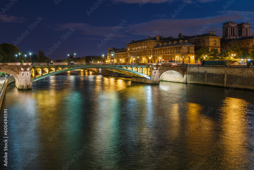 Night view with Seine river and bridge in Paris, France, Europe