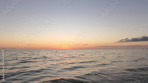 Beautiful sunset glow reflecting on the rippling ocean waves
