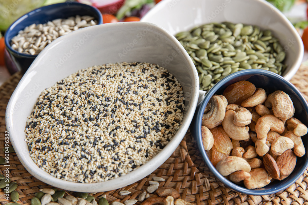 Close-up, a bowl of chia seeds and other healthy foods on the kitchen table.