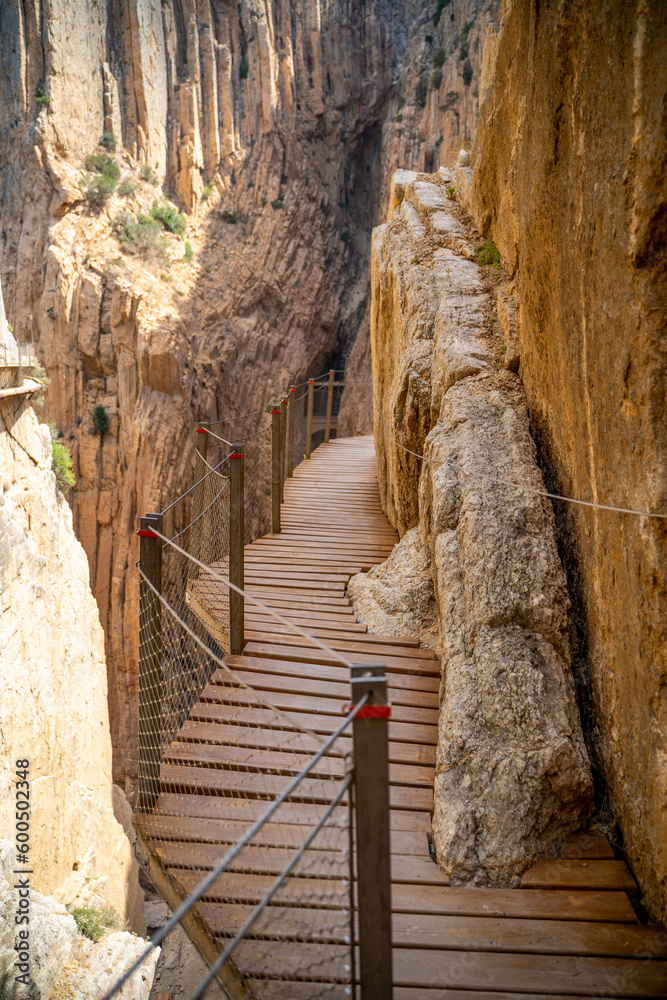 Obraz premium Views of the Caminito del Rey in Malaga, gorges, valleys, walkways, metal walkways, walking along a ferrata route during a sunny summer day