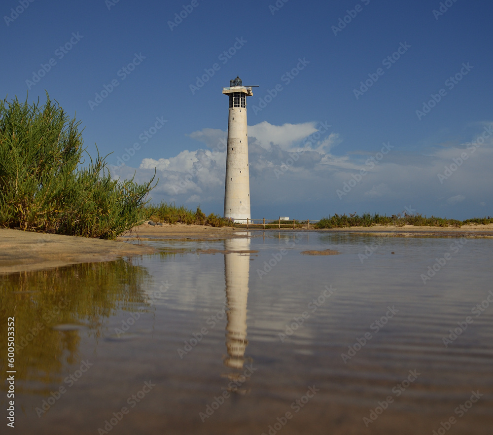 Salt marsh of Jandia and lighthouse of Morro Jable, coast of Fuerteventura, Canary Islands, Spain Salt marsh of Jandia and lighthouse of Morro Jable, coast of Fuerteventura, Canary Islands, Spain