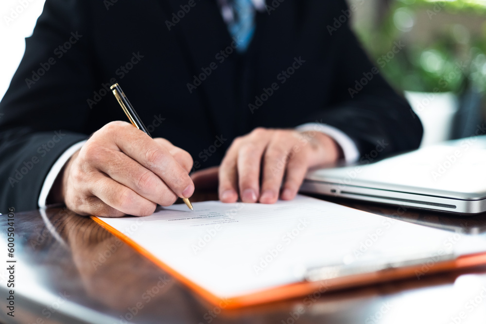 Closeup hand ceo senior man. Business contract and agreement concept. Senior business man and young business asian man signing contract for investment or buy estate and insurance Closeup hand ceo senior man. Business contract and agreement concept. Senior business man and young business asian man signing contract for investment or buy estate and insurance