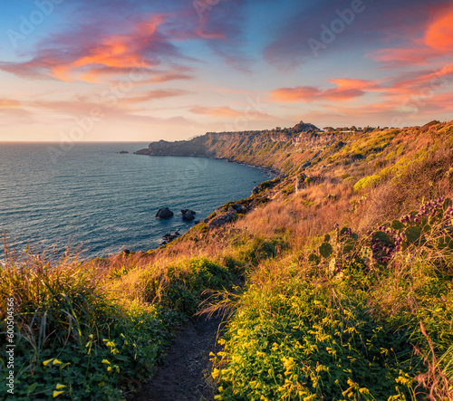 Trekking to Milazzo cape. Exciting sunrise on nature reserve Piscina di Venere, Sicily, Italy, Europe. Wonderful spring seascape of Mediterranean sea. Beauty of nature concept background.
