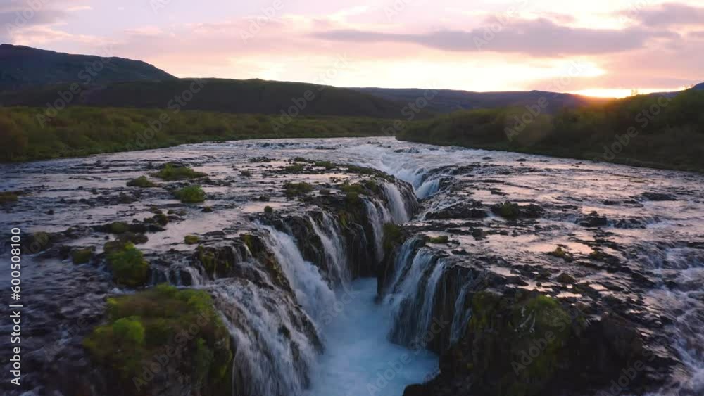 4k drone forward video (Ultra High Definition) of Bruarfoss Waterfall, secluded spot with cascading blue waters. Superb sunrise in Iceland, Europe. Beauty of nature concept background.. 4k drone forward video (Ultra High Definition) of Bruarfoss Waterfall, secluded spot with cascading blue waters. Superb sunrise in Iceland, Europe. Beauty of nature concept background..