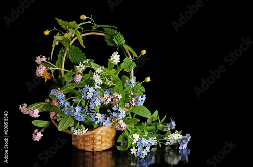 Small basket with spring flowers