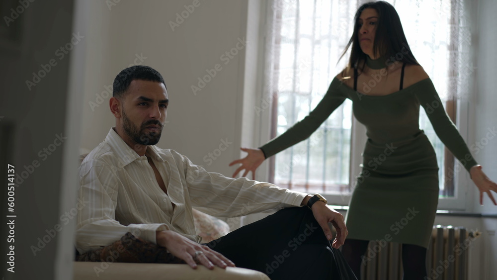 Obraz premium Disengaged Boyfriend_ Girlfriend_s Frustration Escalates as Her Concerns Go Unheard. Woman yelling at man. Relationship in crisis