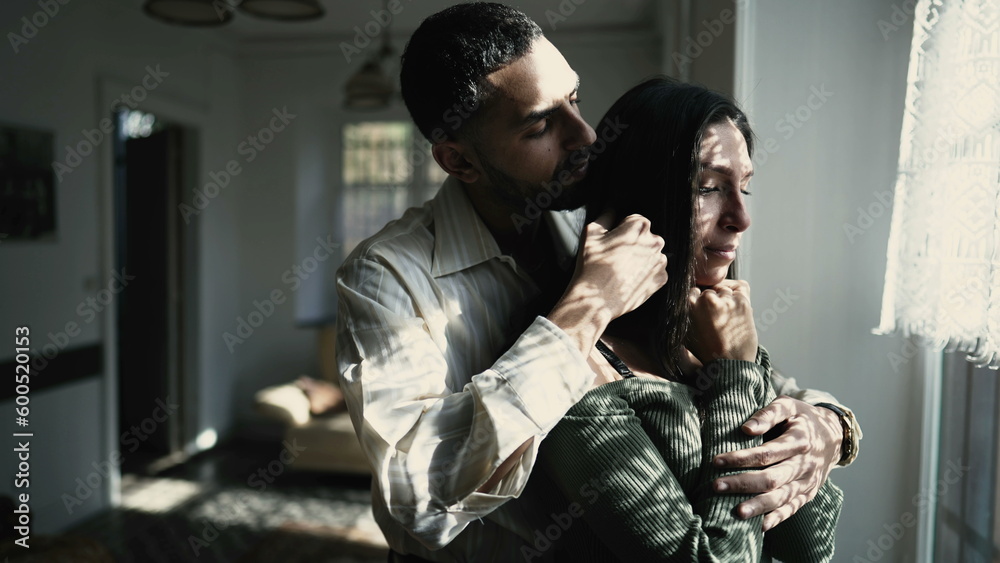 A caring Arab boyfriend comforting his tearful girlfriend by the window during a challenging moment, showing support and empathy