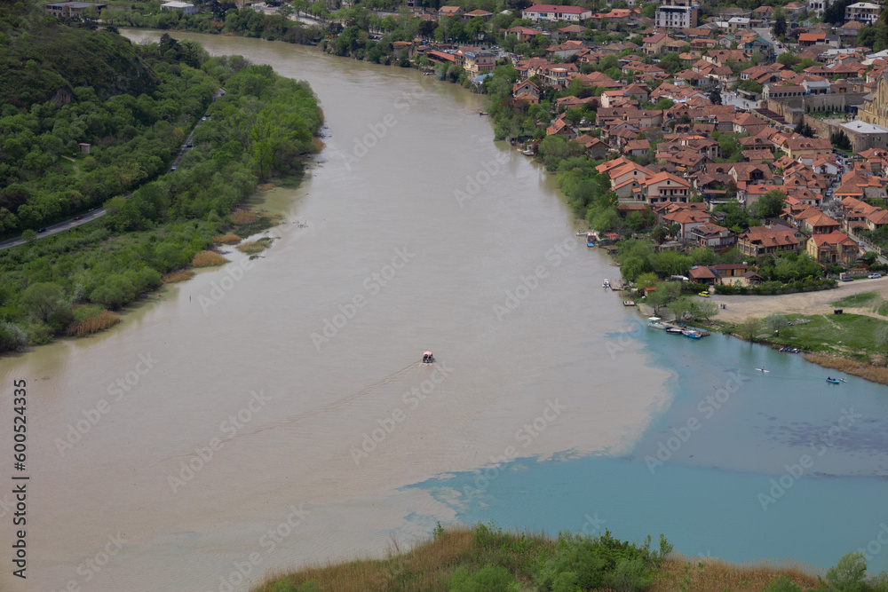 Close up of the place of confluence of the Aragvi and Kura (Mtkvari) rivers, near the old town of Mtskheta (capital of the Kingdom of Iberia). Shot from Jvari monastery. Close up of the place of confluence of the Aragvi and Kura (Mtkvari) rivers, near the old town of Mtskheta (capital of the Kingdom of Iberia). Shot from Jvari monastery.