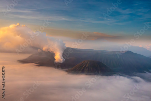 Sunrise over Tengger Semeru National Park wiith a stunning view of two active volcanos: Mount Bromo in the foreground and mount Semeru in the background, East Java, Indonesia.