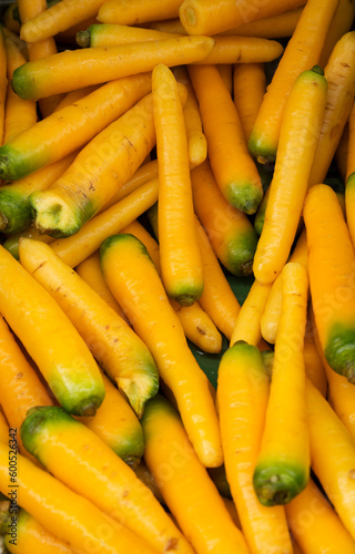 fresh yellow carrots in the street market