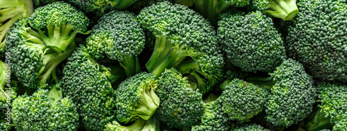 Macro photo green fresh vegetable broccoli. Fresh green broccoli on a black stone table.Broccoli vegetable is full of vitamin.Vegetables for diet and healthy eating.Organic food.