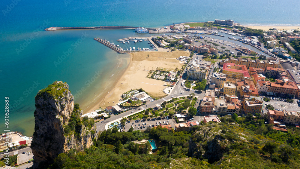 Aerial view of the port of Terracina, near Rome, in the Province of Latina, Italy. There are many boats moored at the marina. In foreground the Levante beach.