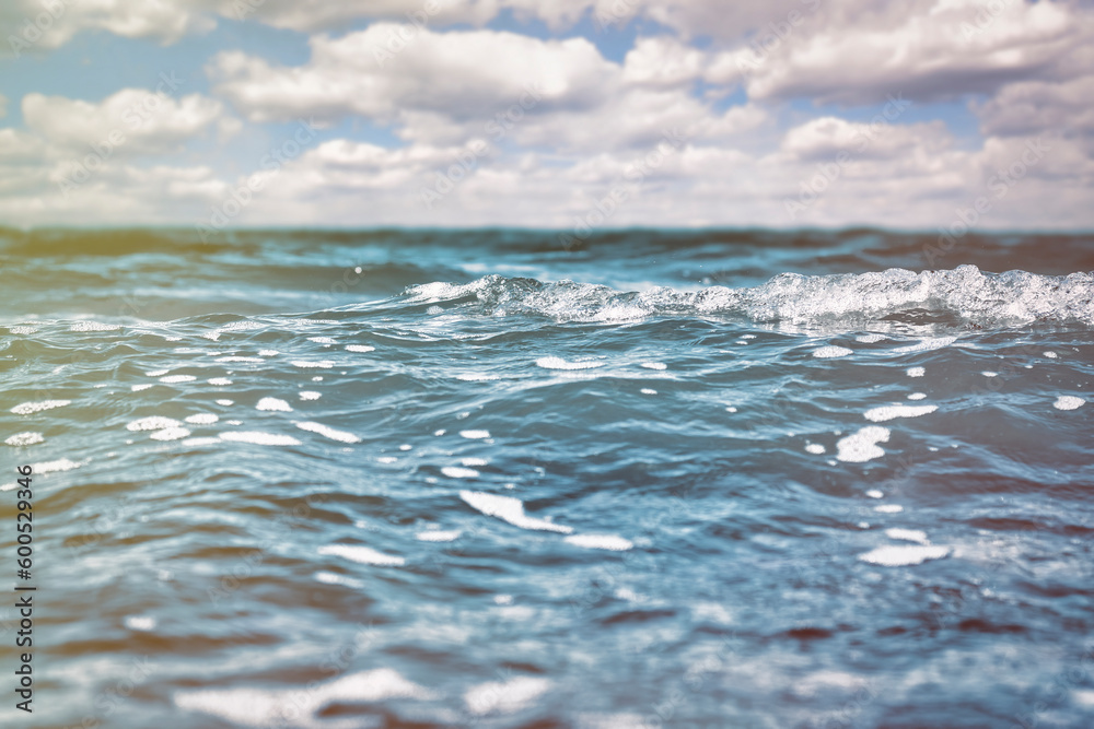 Sea surface with small waves and cloudy sky on the horizon. Sea surface with small waves and cloudy sky on the horizon.