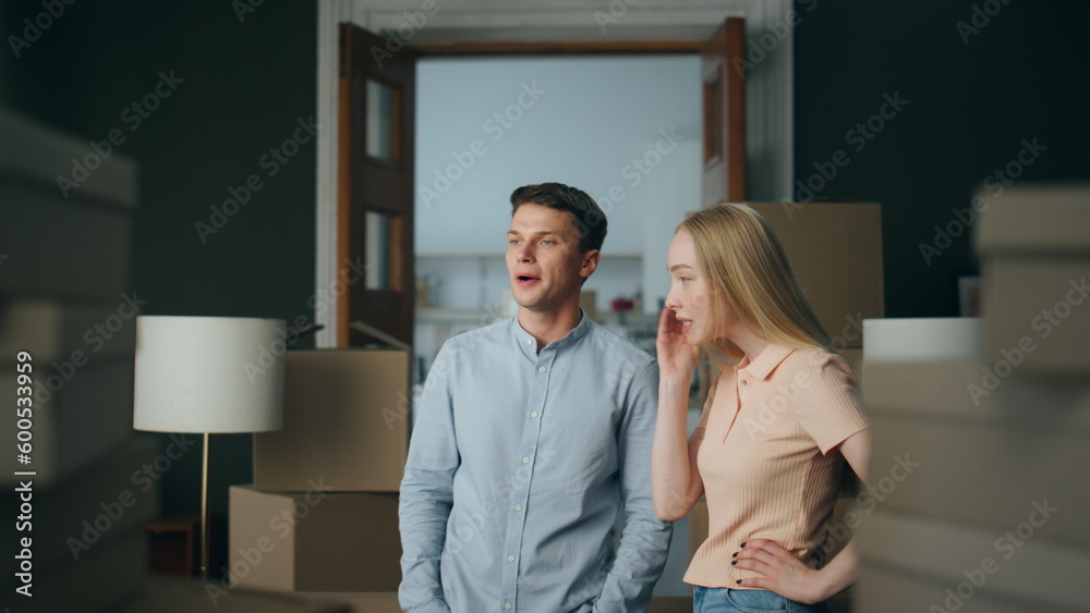 Married pair disputing home close up. Grumpy blond wife shouting on husband. Married pair disputing home close up. Grumpy blond wife shouting on husband.