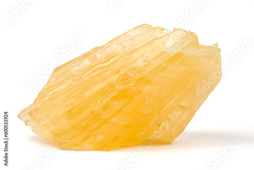 Calcite. A raw nugget of yellow calcite from Poland. A mineral from the carbonate group.