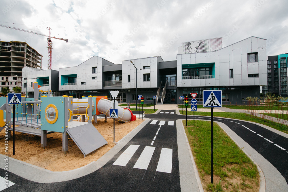 Children's playground of the new kindergarten against the backdrop of the construction of a residential area Children's playground of the new kindergarten against the backdrop of the construction of a residential area