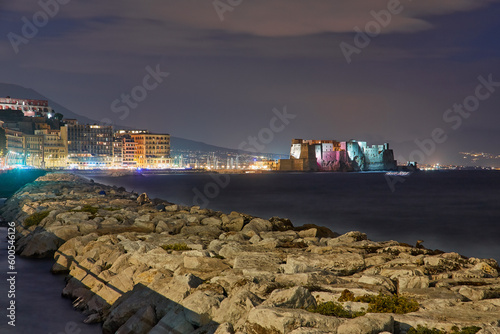 Castel dell Ovo Egg castle in Naples, Italy, view from the seaside quay in evening light photo