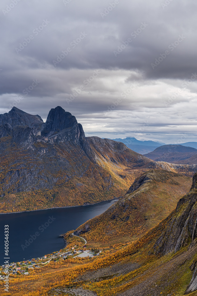 The view in autumn from the ridge next to Segla mountain, on the right, towards the tiny town Fjordgard is spectacular, Troms og Finnmark, Norway