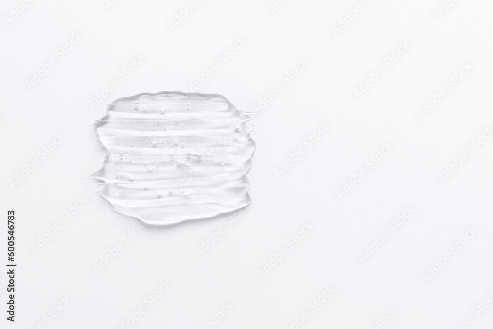 Gel texture of the emulsion on a white background. Clear cream swatch and copy space Gel texture of the emulsion on a white background. Clear cream swatch and copy space