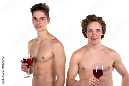 Two young attractive guys are drinking red wine. White background. 