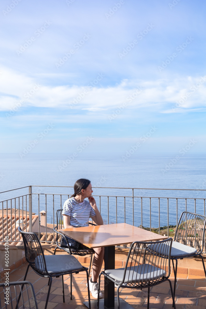 custom made wallpaper toronto digitalreal woman relaxing in a cafe in front of the sea