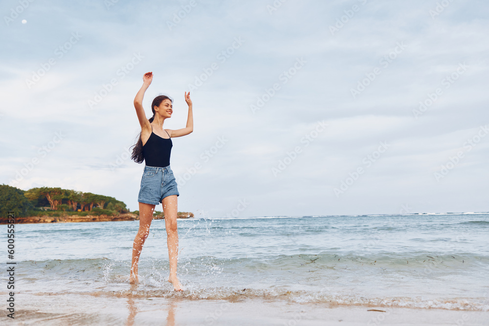 lifestyle woman young smile summer sunset beach water running travel sea lifestyle woman young smile summer sunset beach water running travel sea