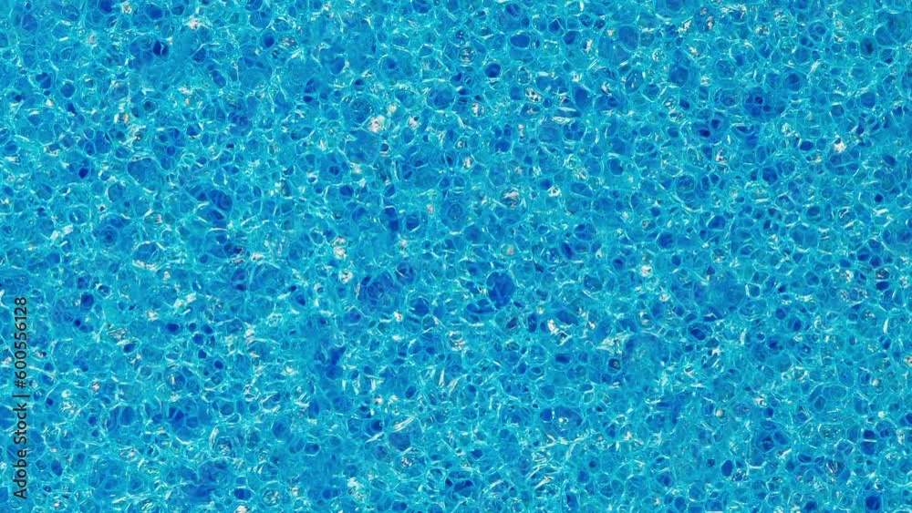 Foam rubber blue sponge, polygonal pores rotating, turning, close-up, macro
Foam rubber blue sponge, polygonal pores rotating, turning, close-up, macro