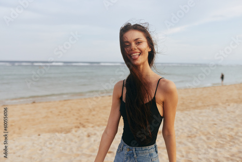 smile woman vacation lifestyle sand sunset beach summer ocean sea adult