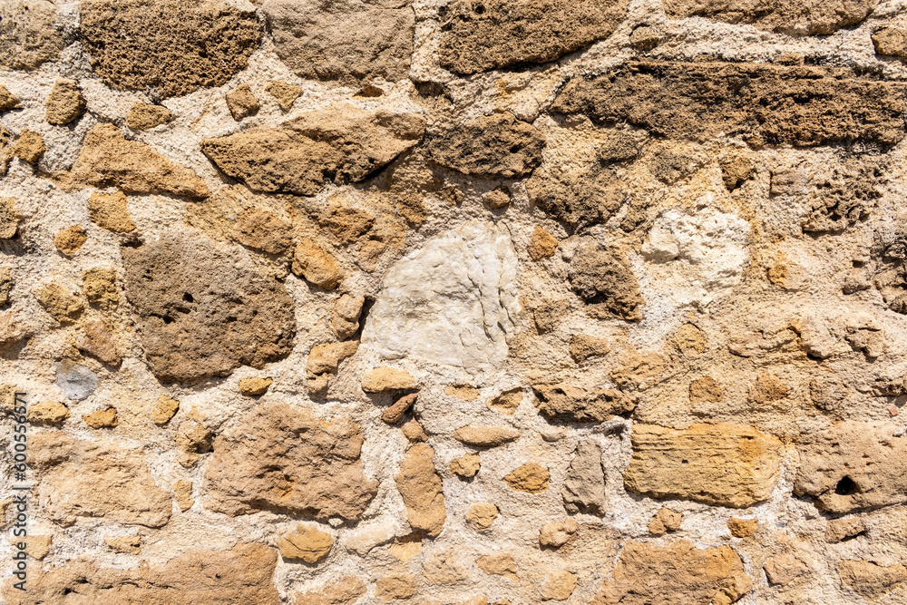 Antique stone yellow wall. Texture background Antique stone yellow wall. Texture background