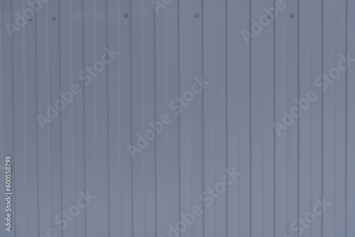 Abstract conctruction gray steel sheet background. Close-up view of corrugated galvanised iron roofing. Copy space for your text and decorations. Construction materials theme. photo