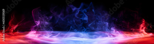 Dramatic smoke and fog in contrasting vivid red, blue, and purple colors. Vivid and intense abstract background or wallpaper.