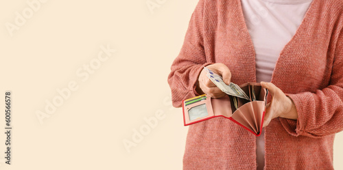 Elderly woman with dollars ...