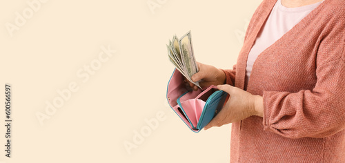 Elderly woman with dollars ...