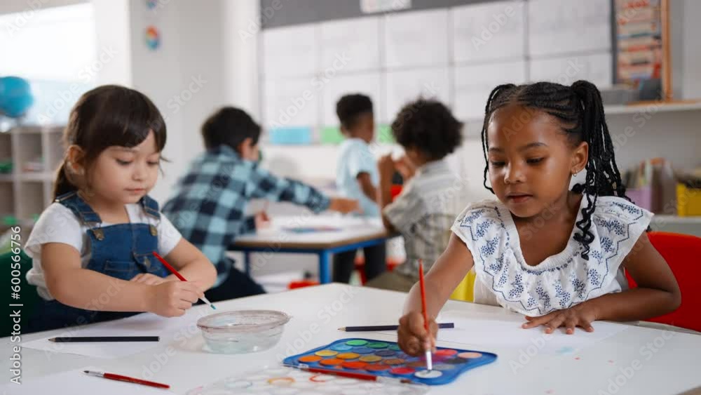 Female elementary school teacher with pupils in art class - shot in slow motion Female elementary school teacher with pupils in art class - shot in slow motion
