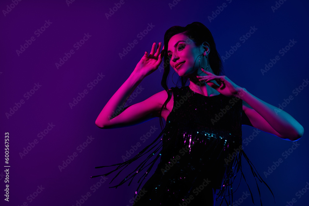 Excited woman dancing disco party 80s 90s theme clothes dress purple magenta pink blue violet neon color background Excited woman dancing disco party 80s 90s theme clothes dress purple magenta pink blue violet neon color background