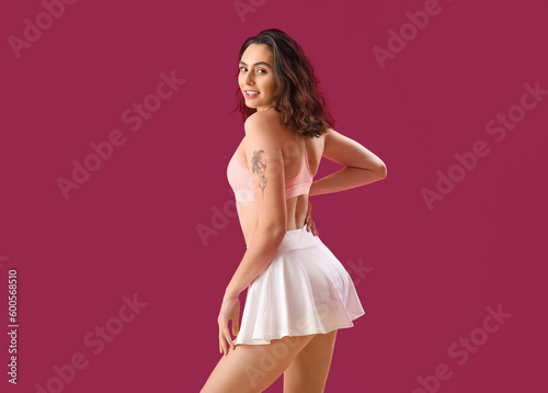 Young woman in sportswear o...