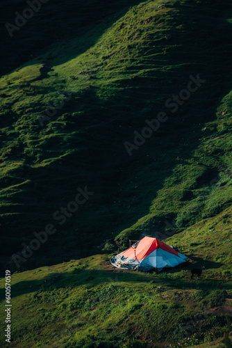 A single camp of tourists in green mountains 