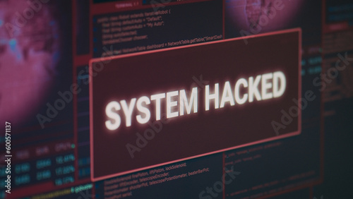 Computer monitor showing hacked system alert message flashing on screen, dealing with hacking and cyber crime attack. Display with security breach warning and malware threat. Close up.